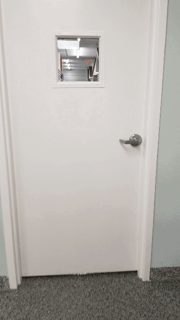 opening the entrance door to the hallway of dog suites